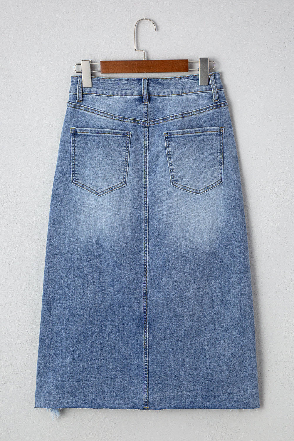 Byzantium Bay denim distressed midi skirt for women, featuring a casual, stylish design with frayed edges and a high-waisted fit.