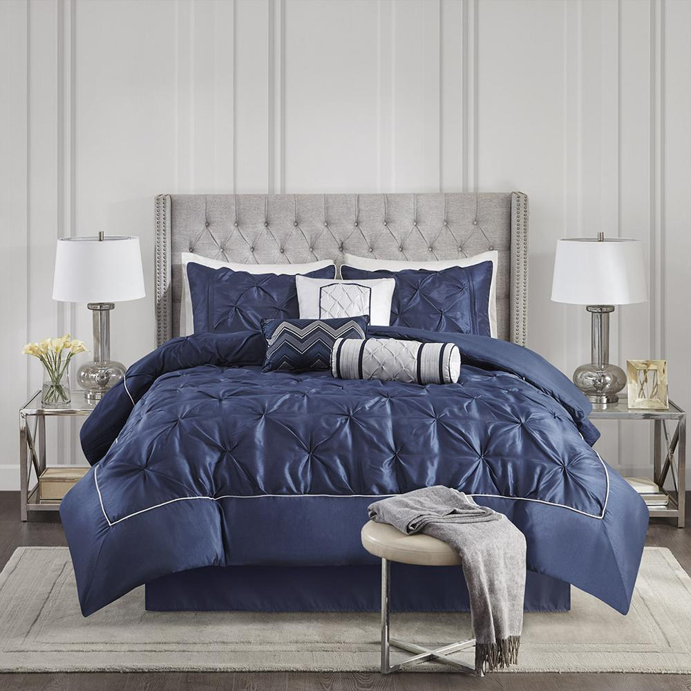 Start2Finish Laurel 7-piece tufted comforter set in navy color, featuring plush fabric and matching pillow shams on a bed.