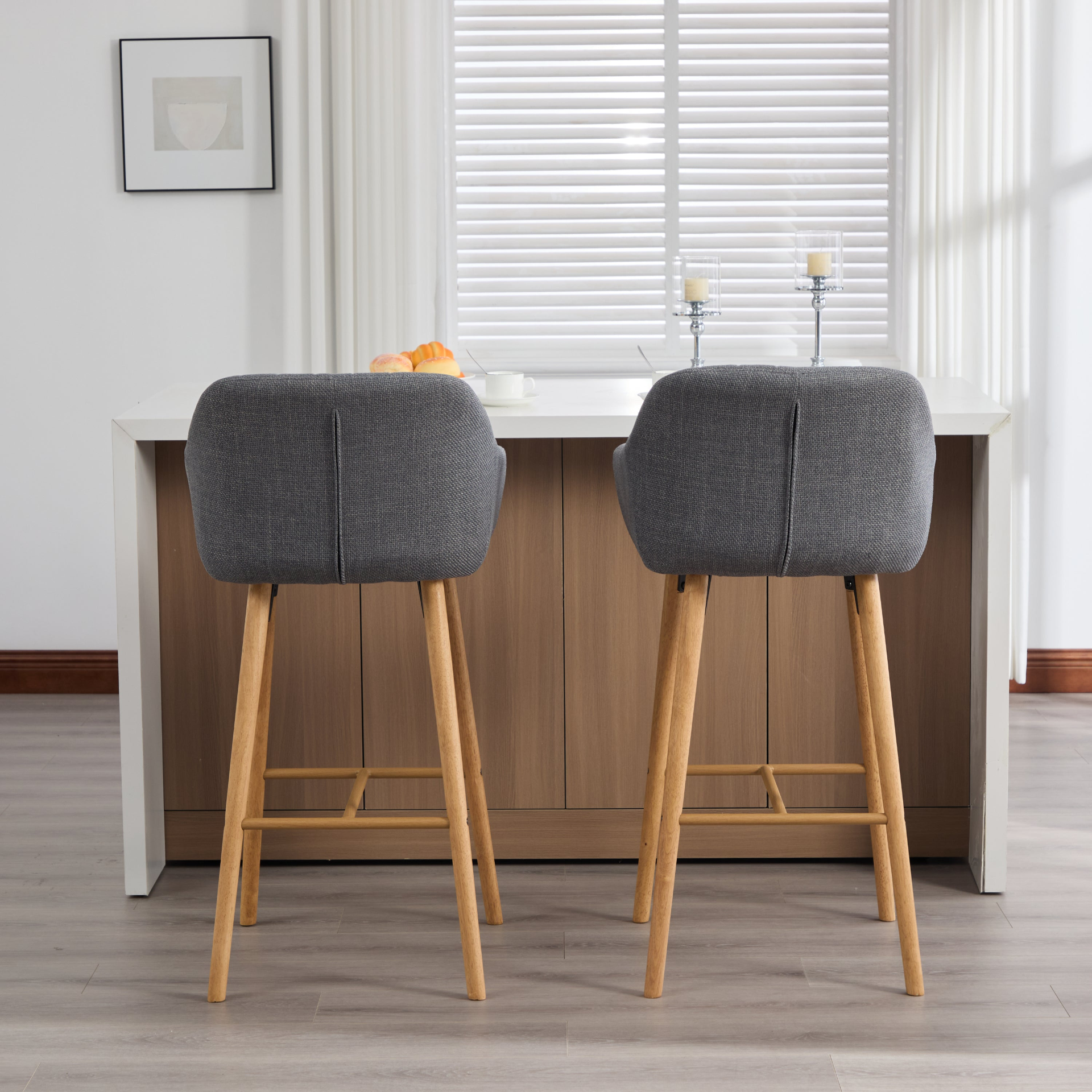 Modern linen upholstered bar stool with backrest, armrests, footrest, and solid wood legs by Start2Finish.