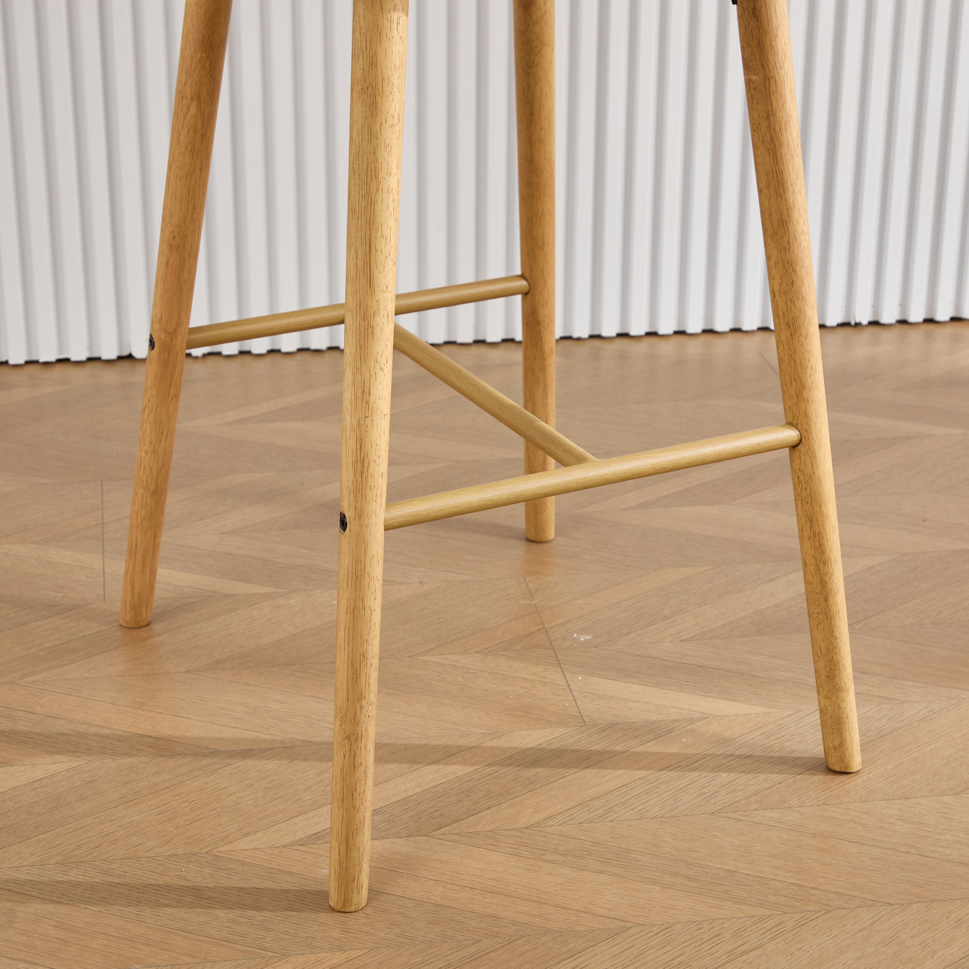 Modern linen upholstered bar stool with back, armrests, footrest, and solid wood legs from Start2Finish.