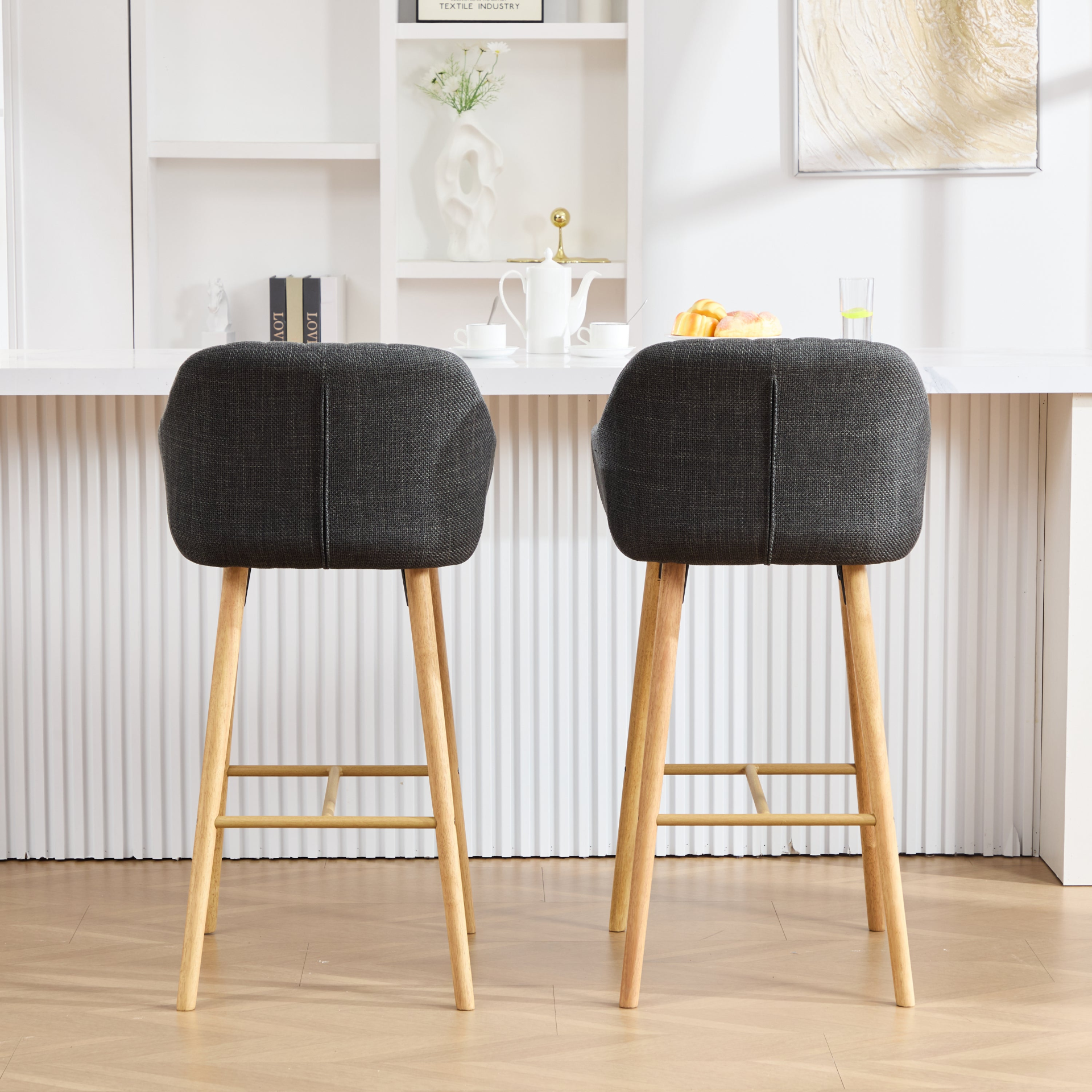 Modern linen upholstered bar stool with backrest, armrests, footrest, and solid wood legs from Start2Finish.