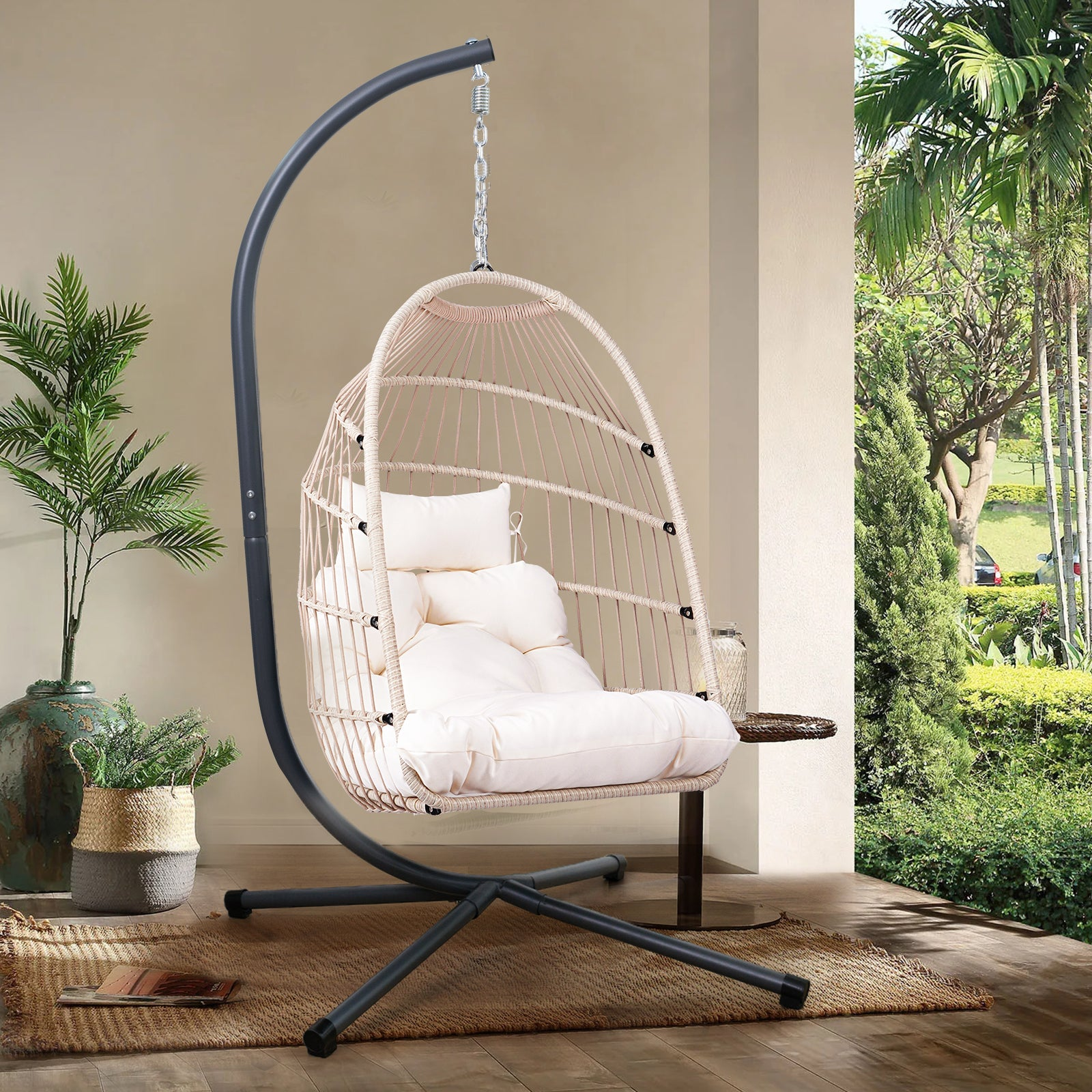 Outdoor hanging egg chair by Start2Finish with stand, wicker rattan swing with cushion for patio lounging.