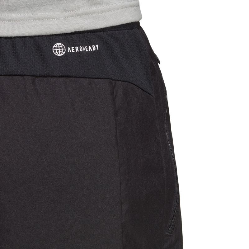 adidas Train Essentials Woven Shorts for men, featuring lightweight fabric and adjustable waistband, in a sporty design.