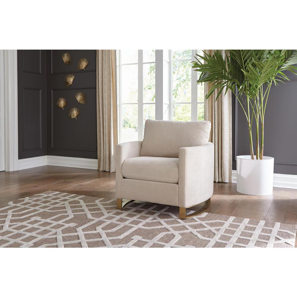 Beige Corliss upholstered arched arm accent chair with plush cushioning and wooden legs, stylishly designed for living room decor.