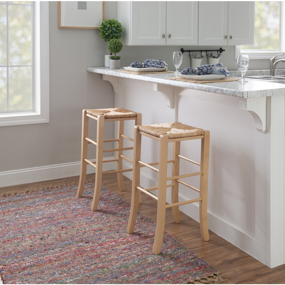 Set of two Gianna backless barstools by Start2Finish featuring natural wooden seats and sleek black metal legs.