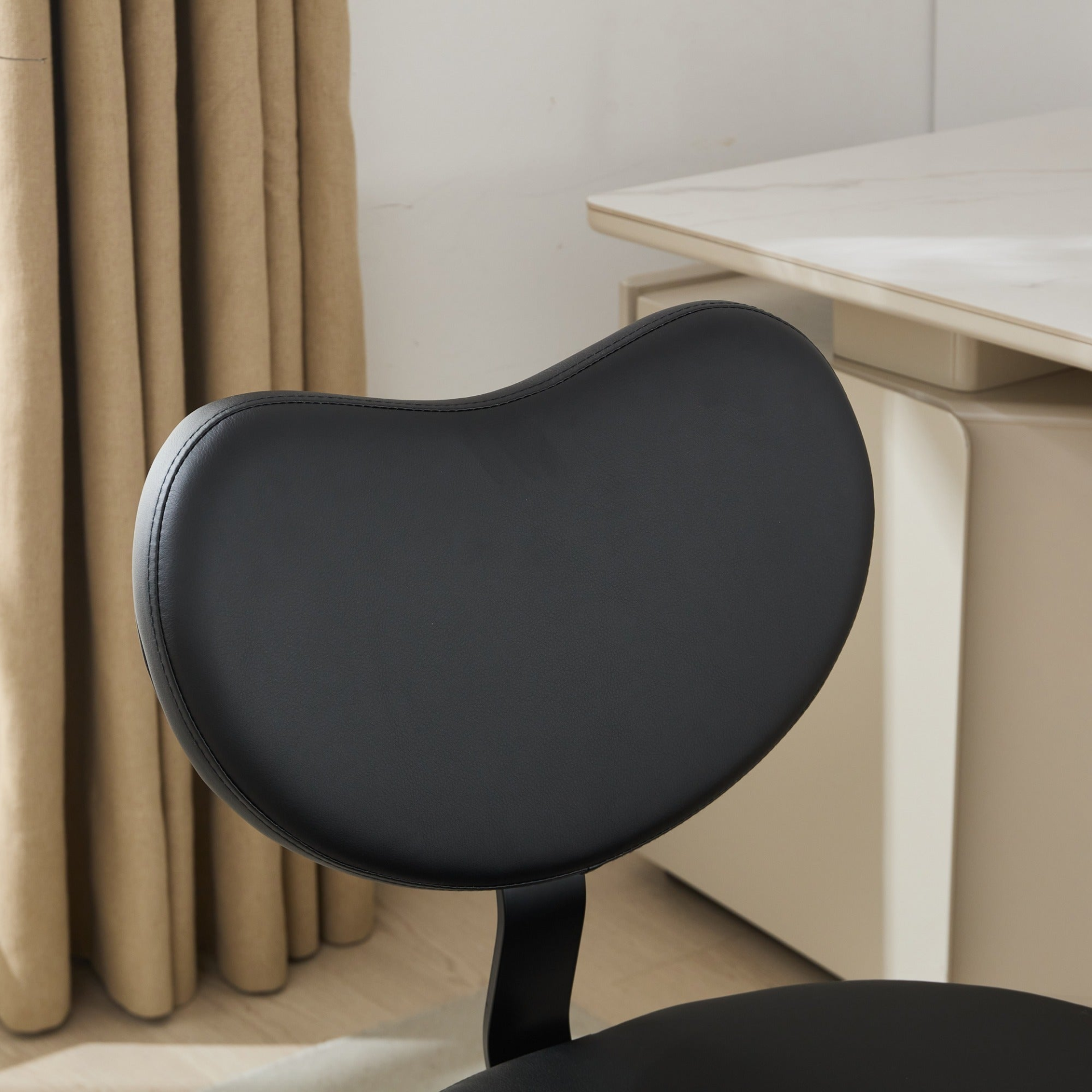 Black PU leather office chair by Start2Finish with USB port, power access, swivel function, ideal for home office or vanity desk.
