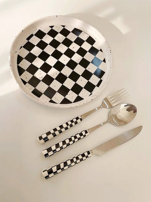 Six-piece set of modern checkered flatware from Inspecial Home, featuring sleek stainless steel utensils for stylish table setting.