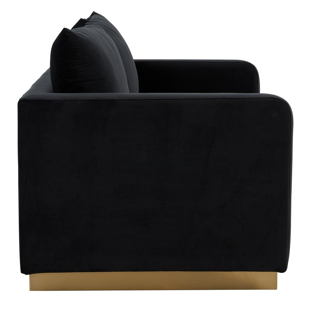 Modern velvet loveseat with gold frame, upholstered in plush fabric, featuring sleek mid-century design and stylish armrests.