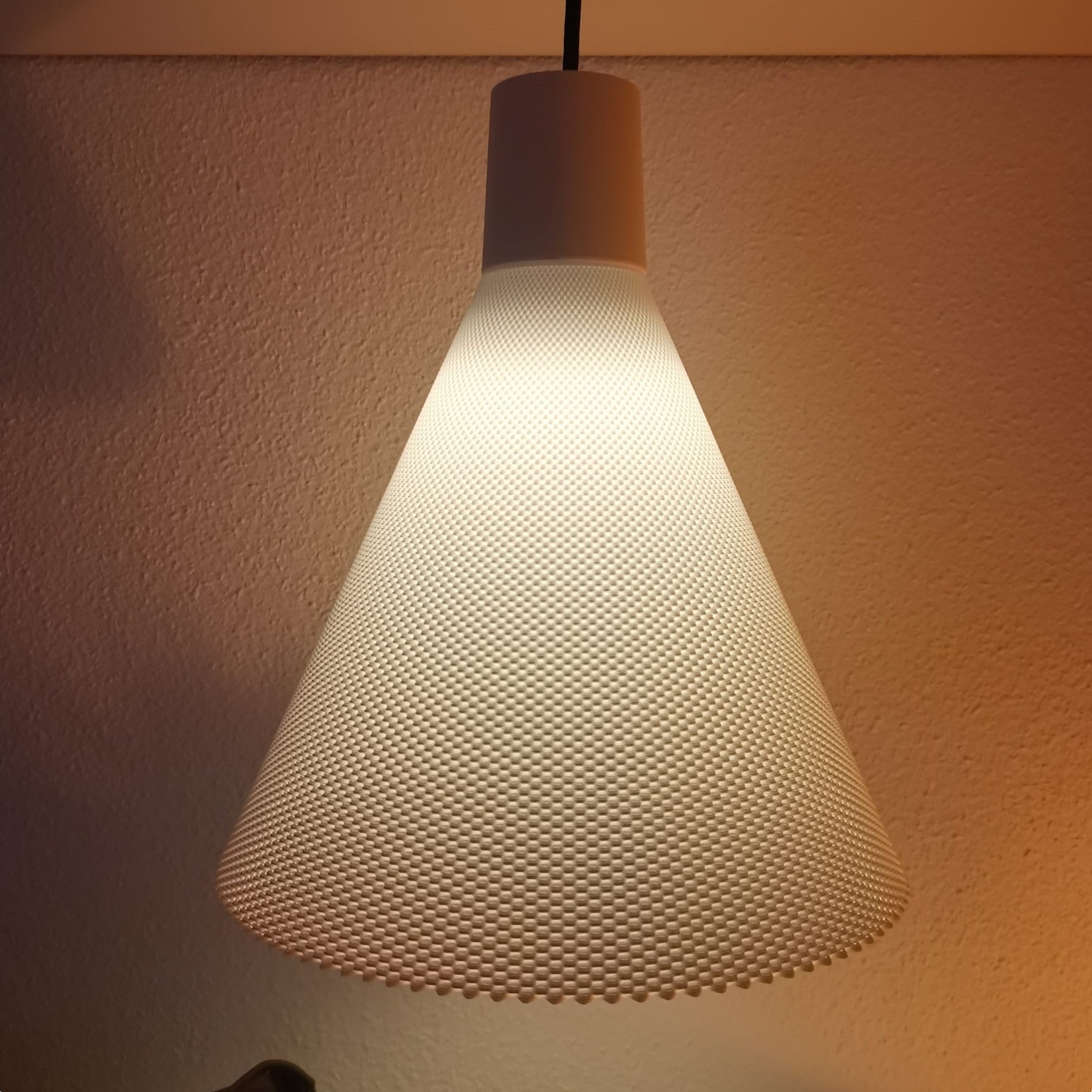 Azure Pontus Conea Light Pendant Lamp hanging with a sleek modern design and warm lighting in a contemporary interior setting.