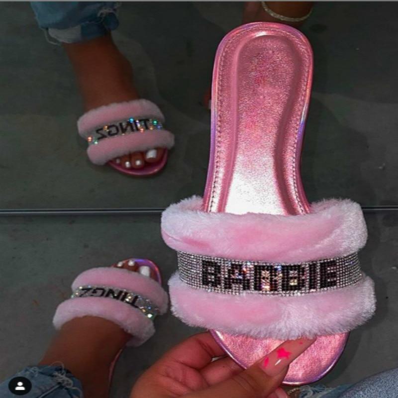 Pink faux fur slides from Silver Juneberry, stylish footwear with plush fur and open-toe design for casual comfort.
