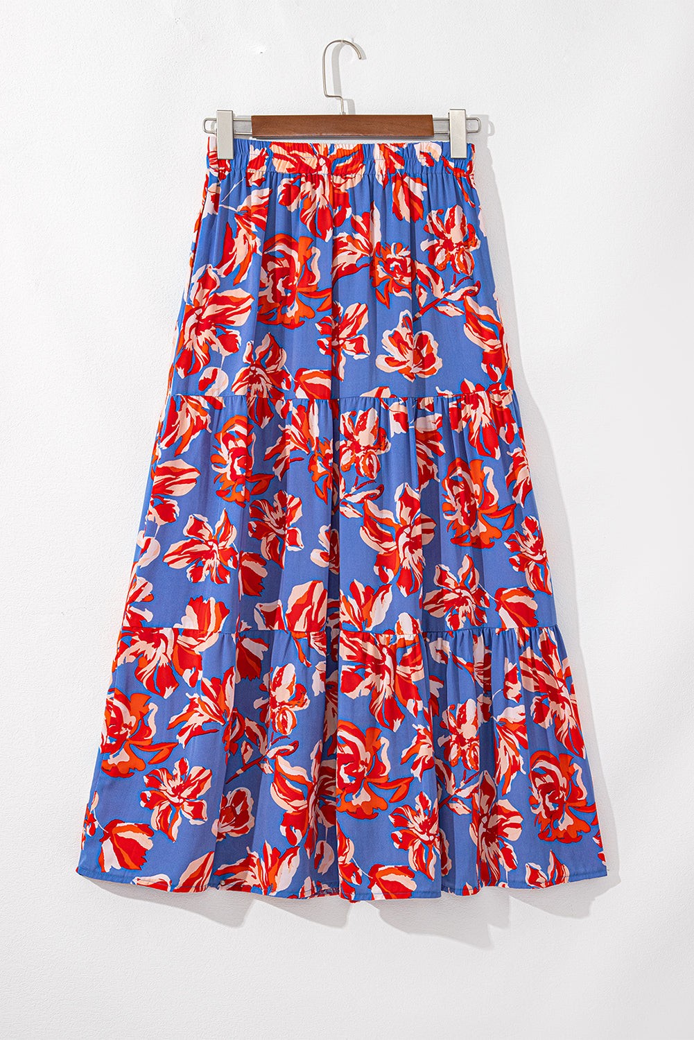 Byzantium Bay boho floral side slit tiered maxi skirt for women with flowing fabric and colorful floral pattern.