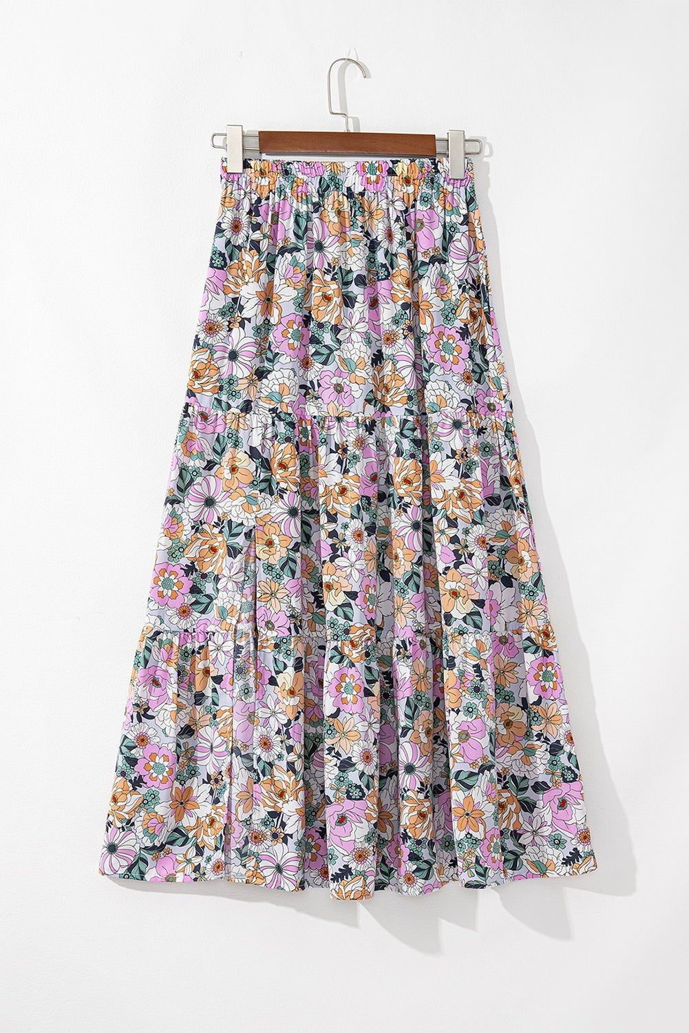 Byzantium Bay boho floral side slit tiered maxi skirt for women, featuring a flowing tiered design with floral patterns and a side slit.
