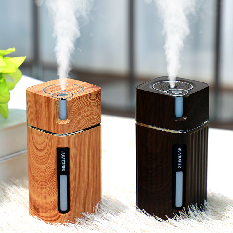 Maroon Asteria ultrasonic air humidifier with LED light, USB mini mist maker for home improvement, showing mist and colorful lighting
