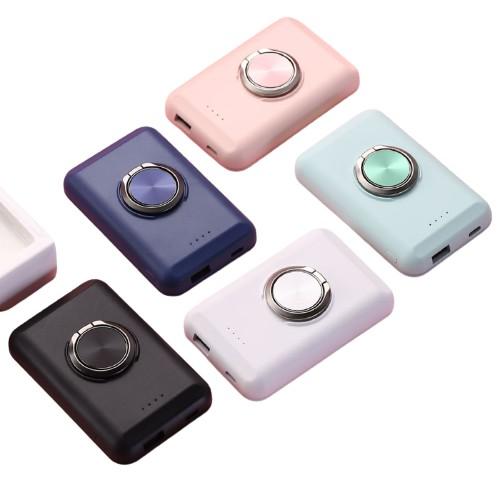Salmon Lucky wireless magnetic charger and power bank for iPhone 12, compact tech accessory with magnetic attachment and charging port.