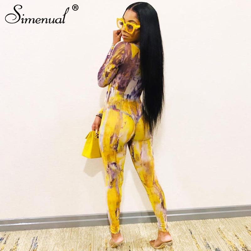 Blue Charlie tie dye mesh bodysuit and pants two-piece set for women, featuring long sleeves and a stylish, sexy design.