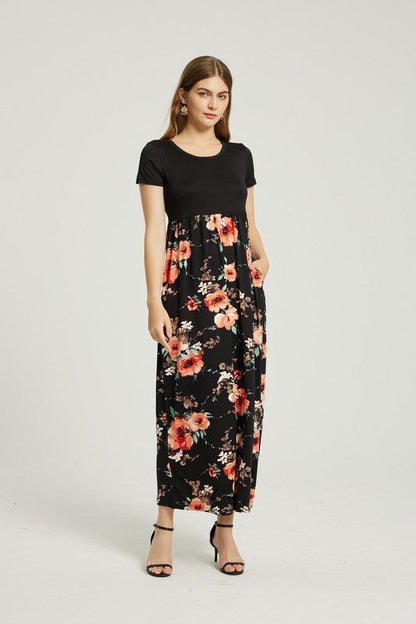 Women’s floral maxi dress by Jade Icarus featuring casual summer style with pockets, lightweight fabric, and vibrant floral pattern.
