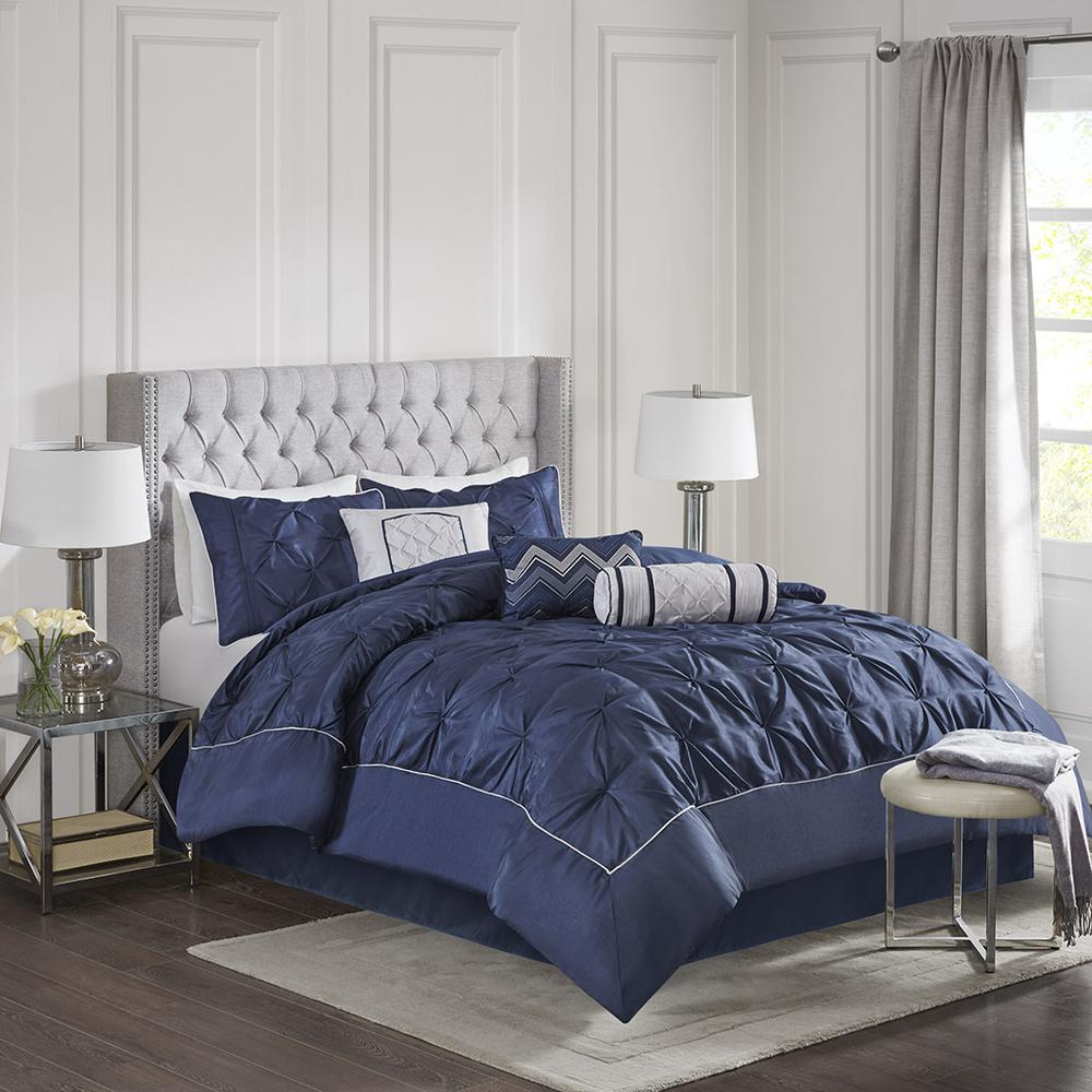 Start2Finish Laurel 7-piece tufted comforter set in navy with matching pillows and bedding details on a bed.