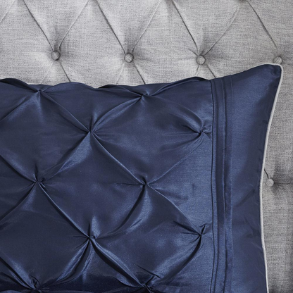 Start2Finish Laurel 7-piece tufted comforter set in navy with matching pillow shams and decorative bedding for a cozy bedroom look.
