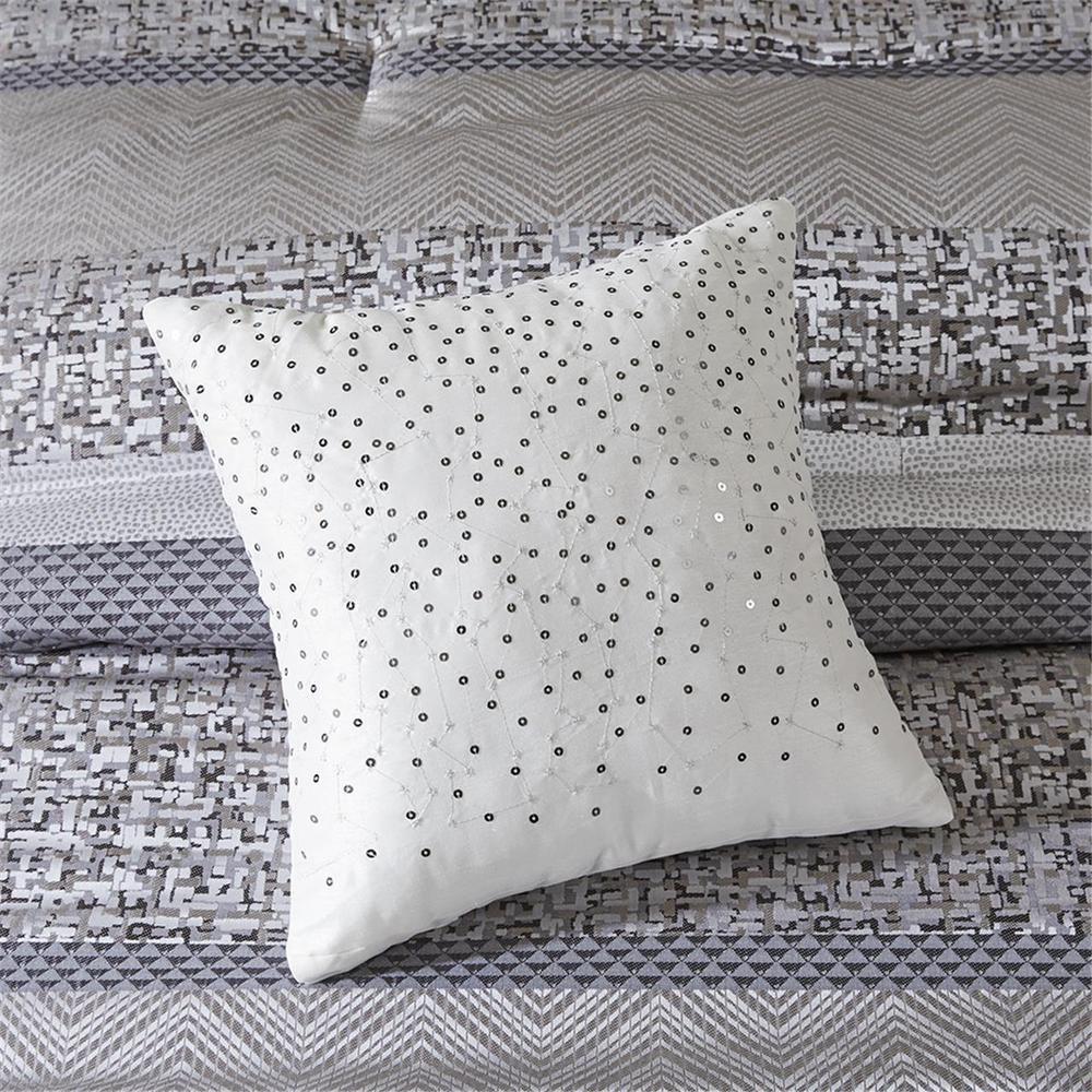 Start2Finish 7-piece jacquard comforter set with intricate woven pattern and matching pillow shams on a neatly made bed.