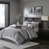 Start2Finish 7-piece Jacquard comforter set with matching pillow shams and decorative pillows on a bed, detailed patterned fabric.