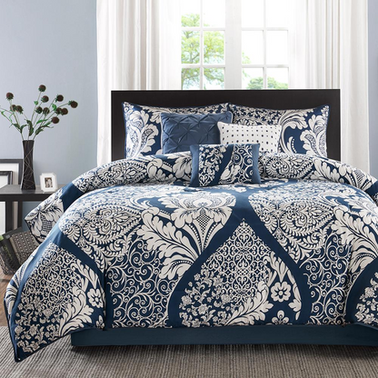 Vienna 7-piece cotton printed comforter set in indigo color with matching pillow shams and decorative accents.