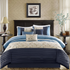 Serene embroidered navy 7-piece comforter set by Start2Finish, showing detailed floral embroidery on soft fabric with matching pillow shams.