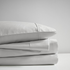 Start2Finish Pima Cotton Sheet Set with neatly folded white sheets and pillowcases, showcasing soft, high-quality bedding.