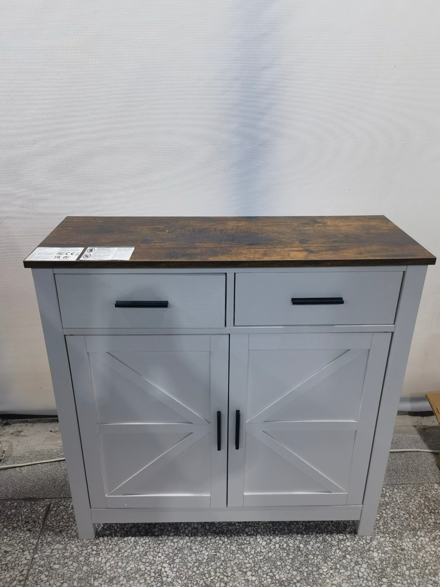 Modern farmhouse kitchen storage cabinet by Start2Finish with two drawers, two doors, and a sleek design for organized space.
