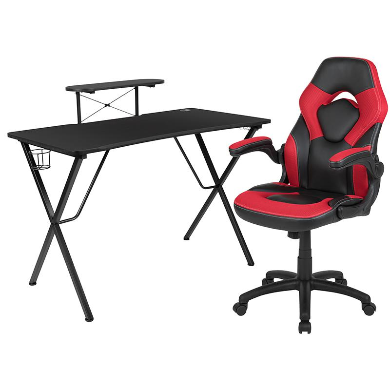 Black gaming desk with a red and black racing chair set by Start2Finish, shown with gaming accessories and a modern workspace setup.