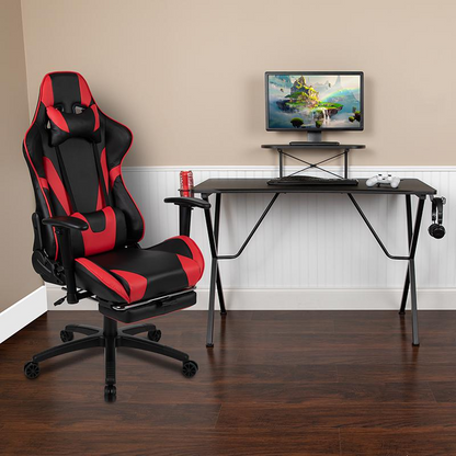 Start2Finish black gaming desk with sleek surface and matching red/black gaming chair with ergonomic design and footrest.