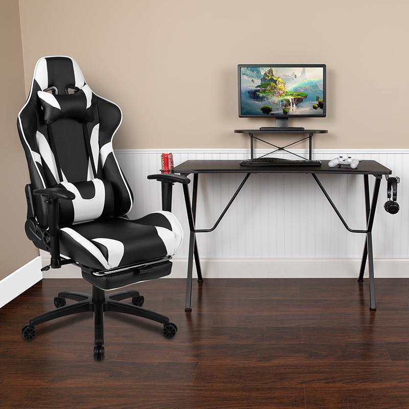 Black Start2Finish gaming desk and reclining gaming chair with black footrest, designed for comfort and gaming setup.