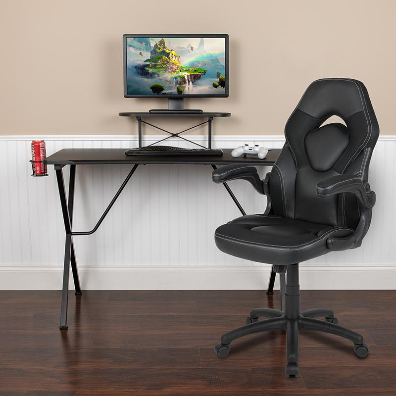 Start2Finish black gaming desk with matching black racing chair, featuring a sleek design and ergonomic features for gaming setup.