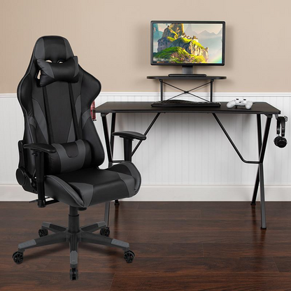 Start2Finish black gaming desk with sleek surface and gray reclining gaming chair, ideal for a comfortable gaming setup.