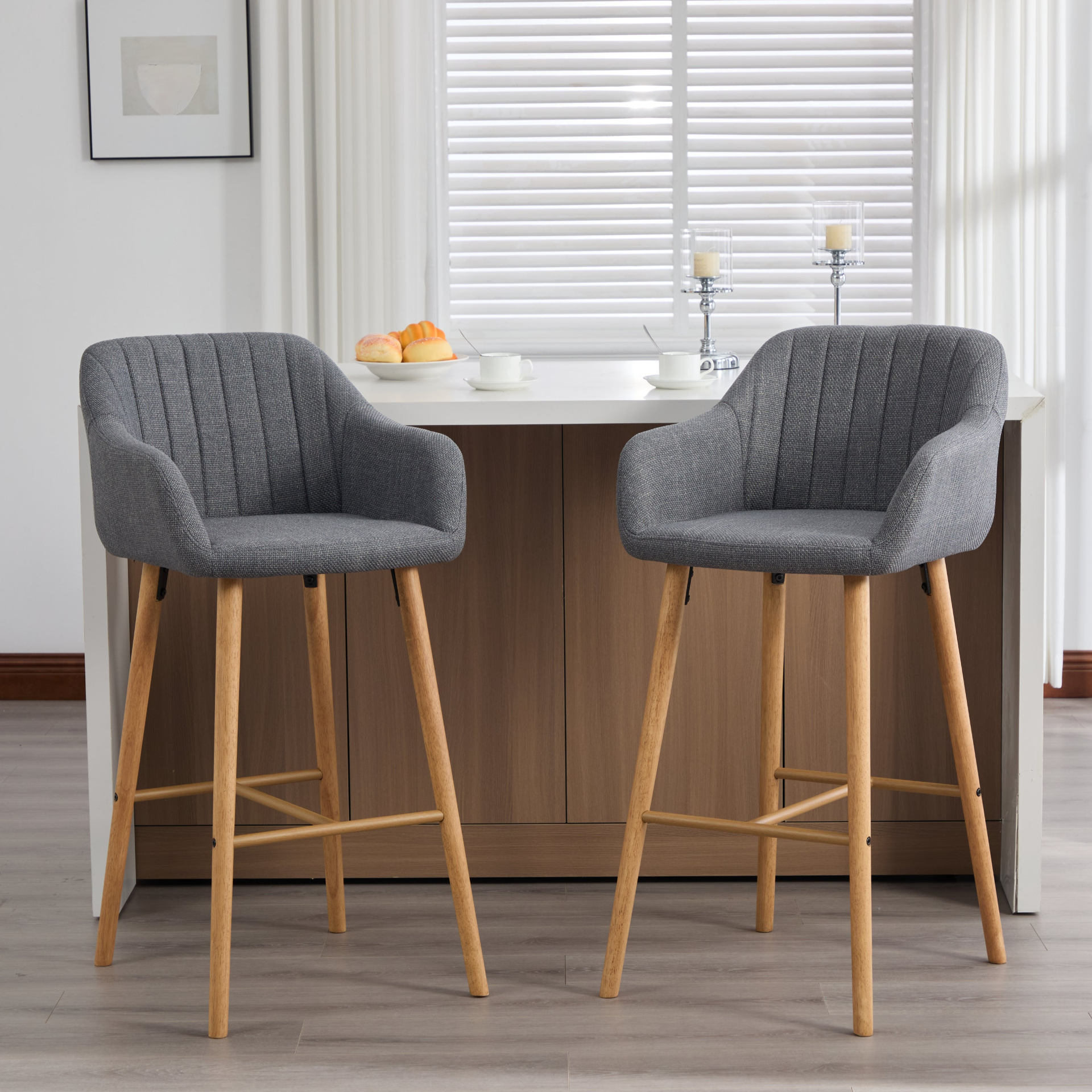 Modern linen upholstered bar stool with back, armrests, footrest, and solid wood legs from Start2Finish