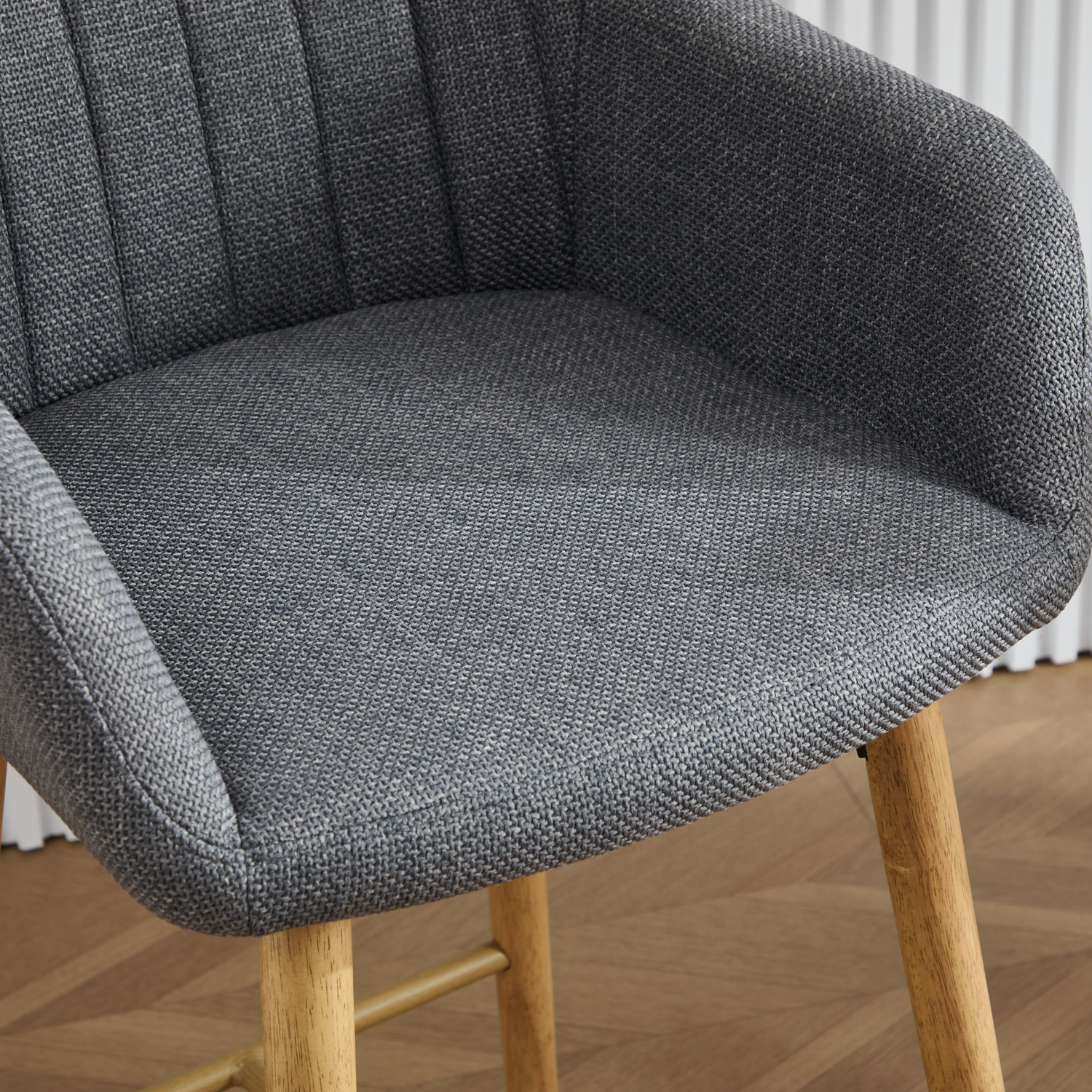 Modern linen upholstered bar stool with back, armrests, footrest, and solid wood legs by Start2Finish.
