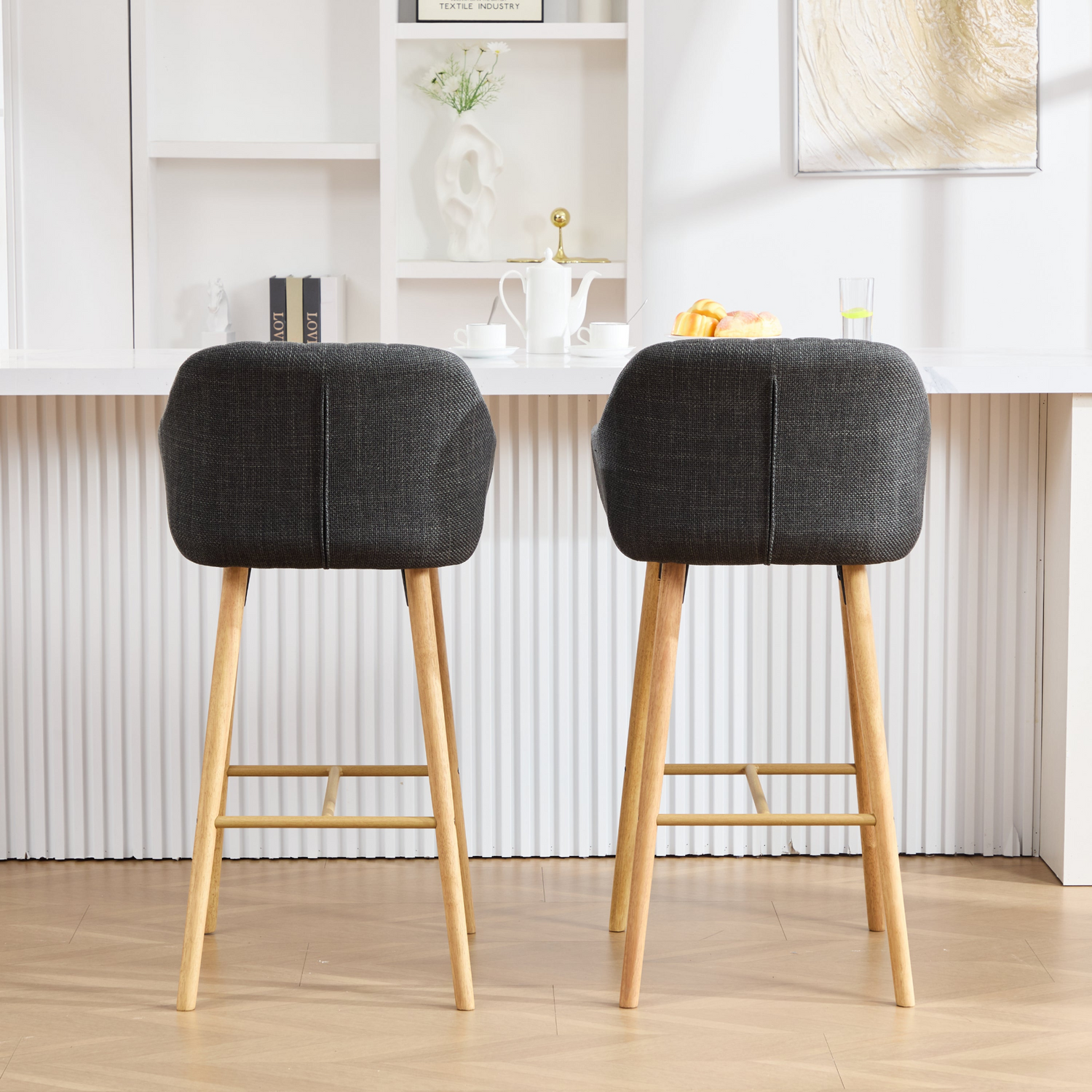 Modern linen upholstered bar stool with backrest, armrests, footrest, and solid wood legs from Start2Finish.