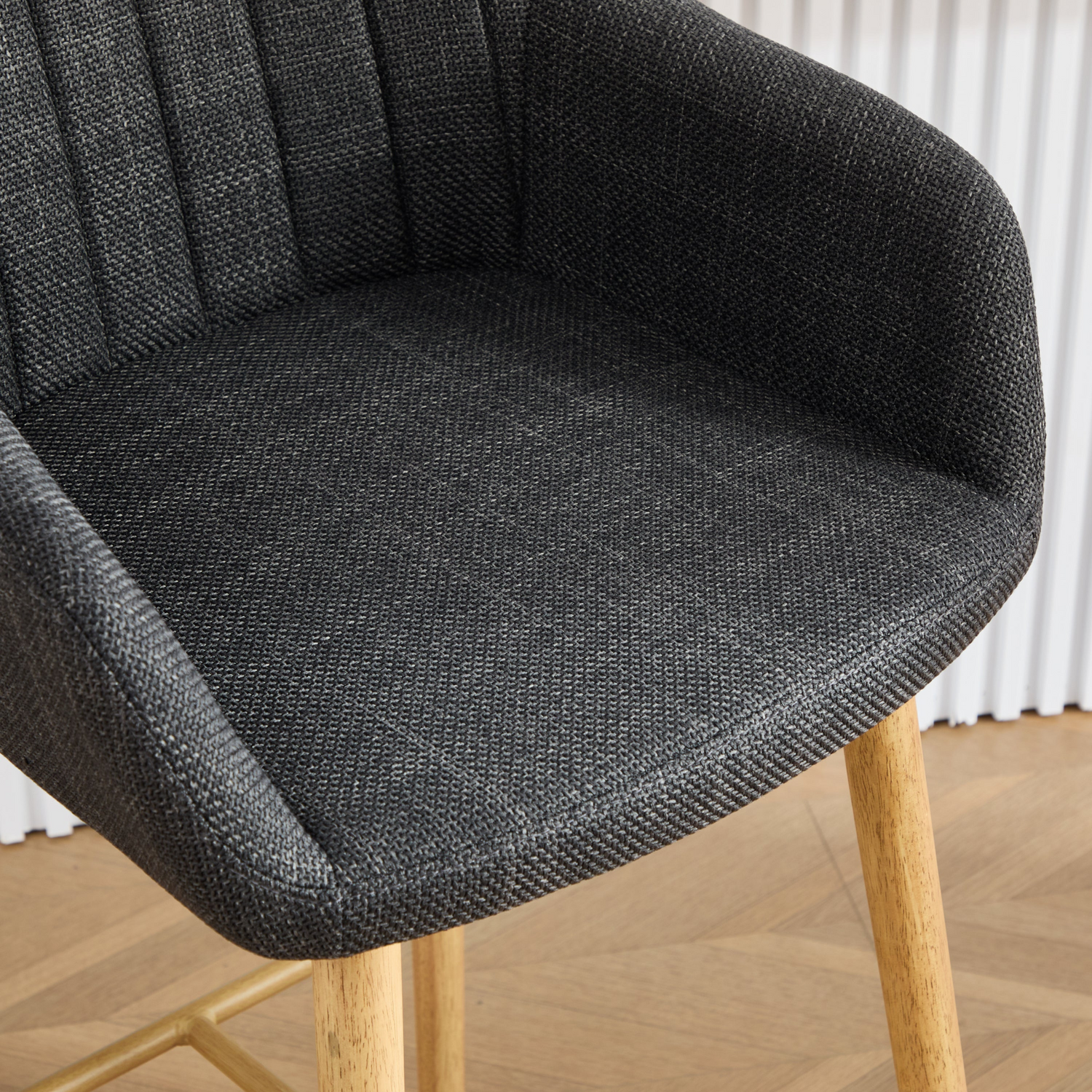 Modern linen upholstered bar stool with back, armrests, footrest, and solid wood legs by Start2Finish.