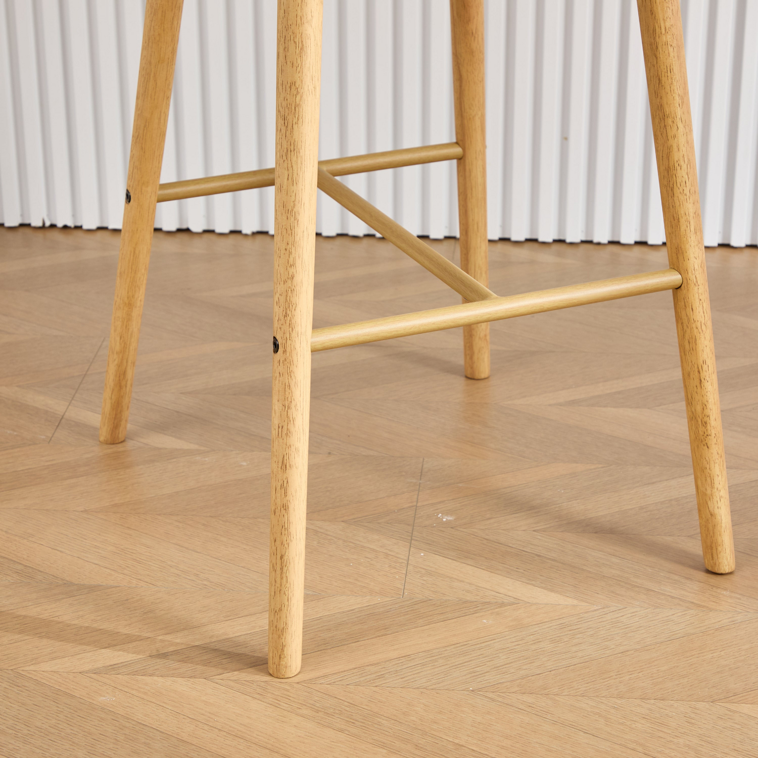 Modern linen upholstered bar stool with back, armrests, footrest, and solid wood legs by Start2Finish.