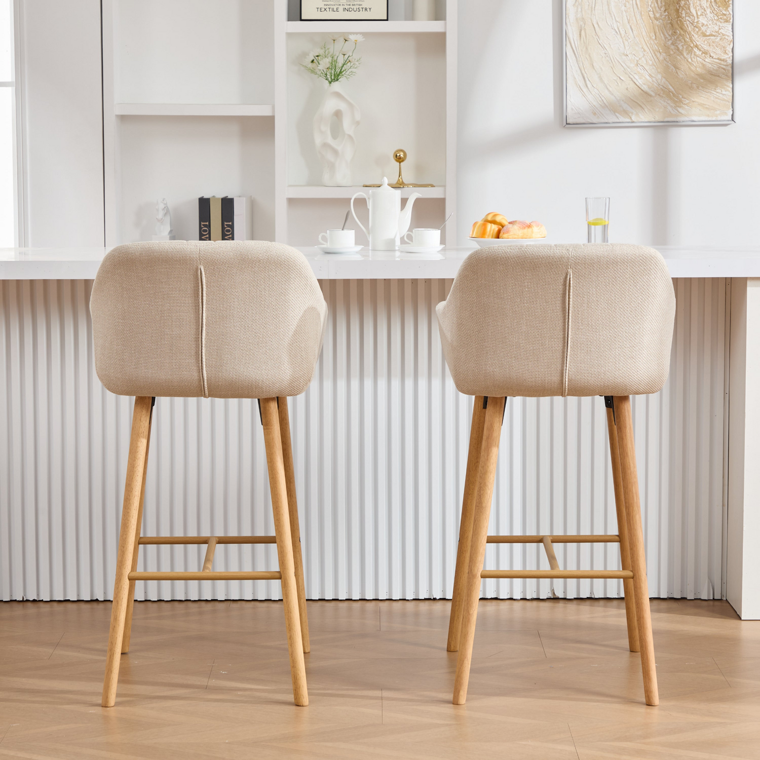 Modern linen upholstered bar stool from Start2Finish with backrest, armrests, footrest, and solid wood legs.