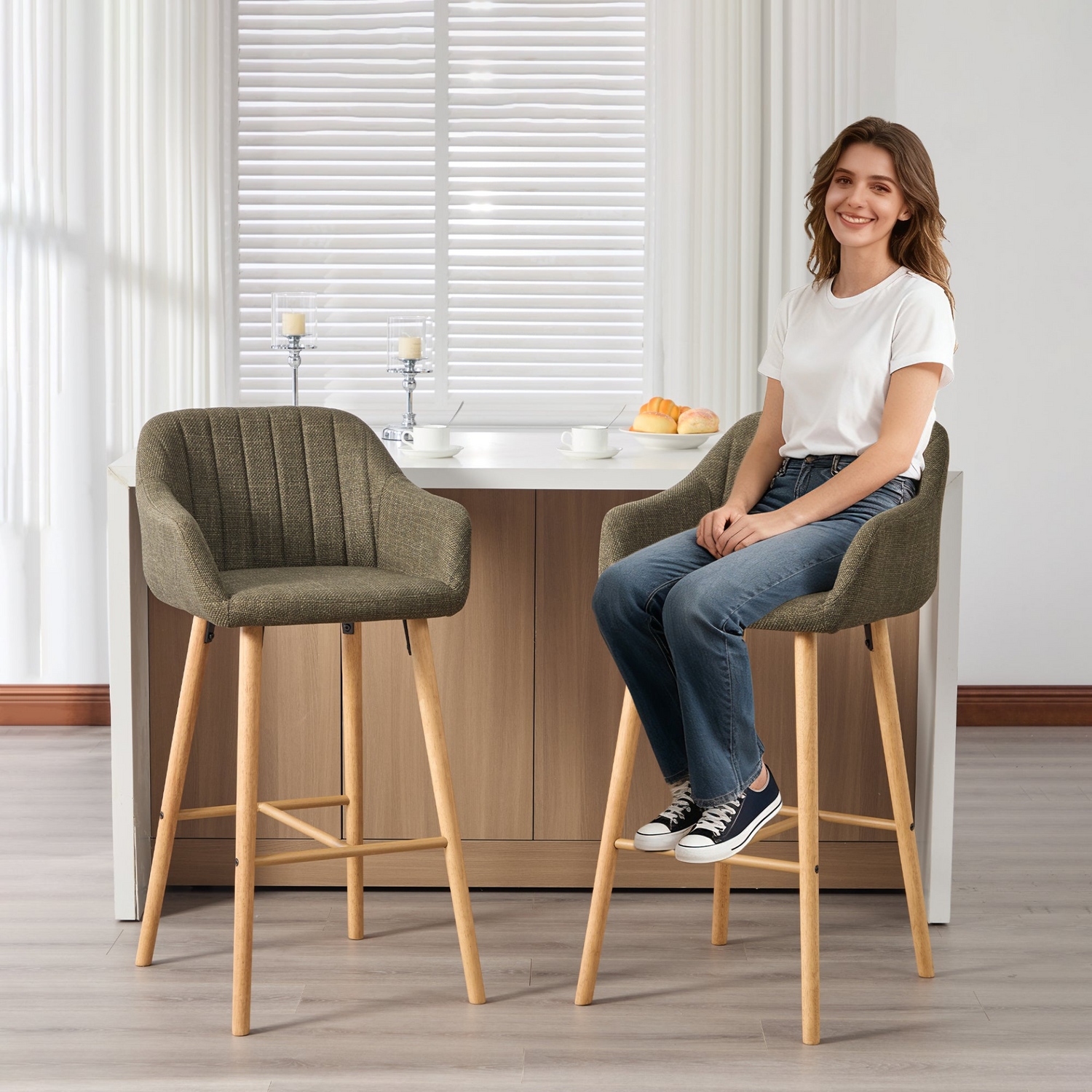 Modern linen upholstered bar stool with back, armrests, footrest, and solid wood legs by Start2Finish.