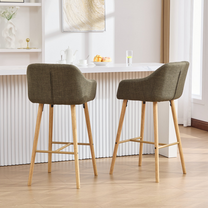 Modern linen upholstered bar stool with back, armrests, footrest, and solid wood legs by Start2Finish.