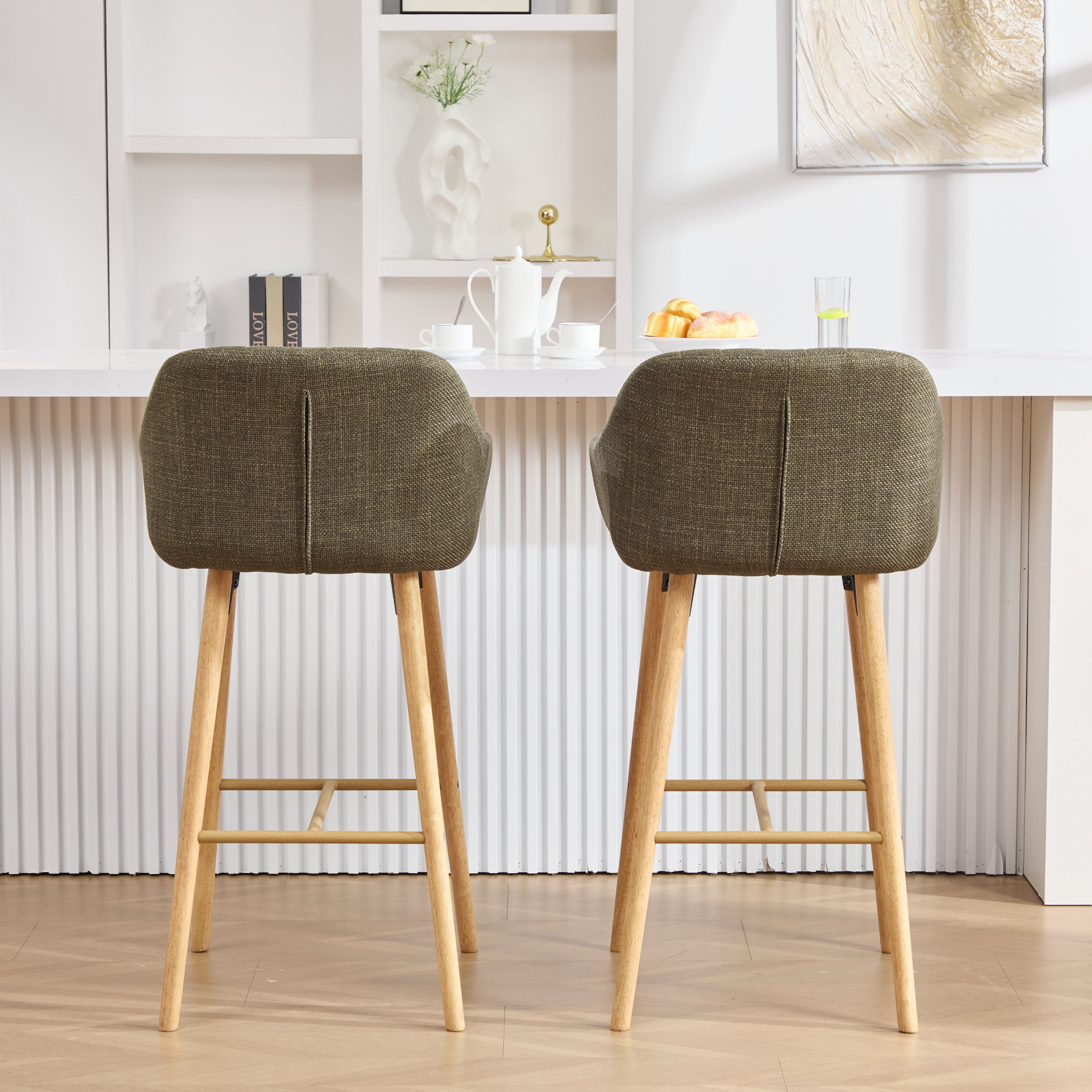 Modern linen upholstered bar stool with back, armrests, footrest, and solid wood legs by Start2Finish.