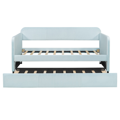 Start2Finish twin size upholstered daybed sofa bed with trundle and wood slat base, shown with cushions and bedding.