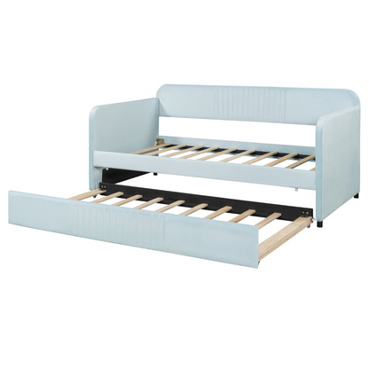 Start2Finish upholstered twin size daybed sofa bed with trundle and wood slat base, shown with cushions in a cozy living space.