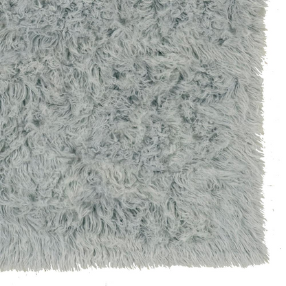 Light grey Flokati rug by Start2Finish, 5x8 feet, 1400 grams, showcasing soft, plush wool texture on a flat surface.
