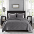 Start2Finish Harper 3-piece grey velvet quilt set with matching pillow shams on a bed, showcasing luxurious bedding.