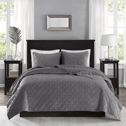 Start2Finish Harper 3-piece velvet quilt set in grey, showing a soft, plush quilt with matching pillow shams on a bed.