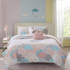 Reversible cotton quilt set by Start2Finish with matching throw pillows, showcasing soft, colorful bedding on a neatly made bed.