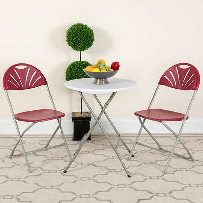 Two burgundy HERCULES Series plastic folding chairs with fan back design, 650 lb. capacity, by Start2Finish.