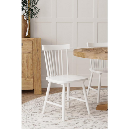 Set of 2 white Lyra side chairs by Start2Finish with modern design and sleek legs, ideal for dining or casual seating.